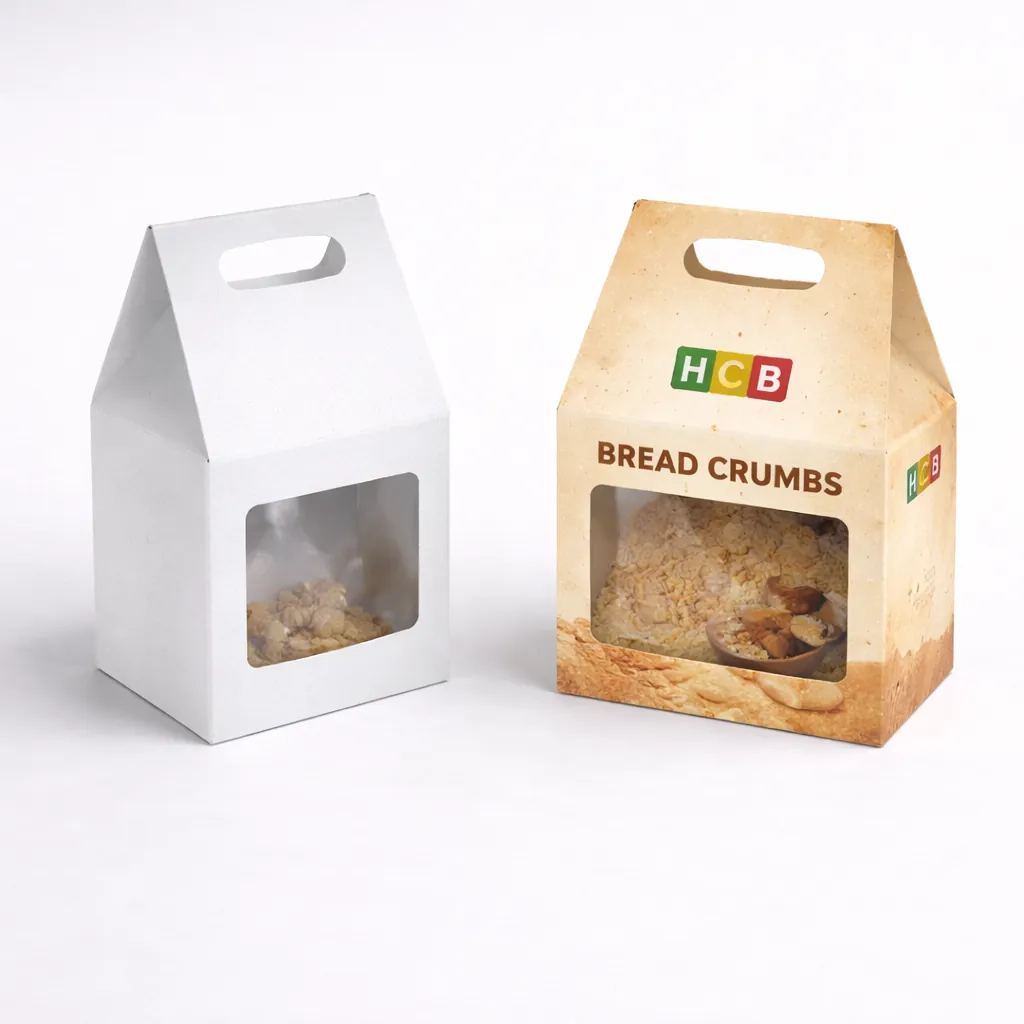 Plain white and custom-printed gable top boxes with die-cut windows showing breadcrumbs and a handle. class=